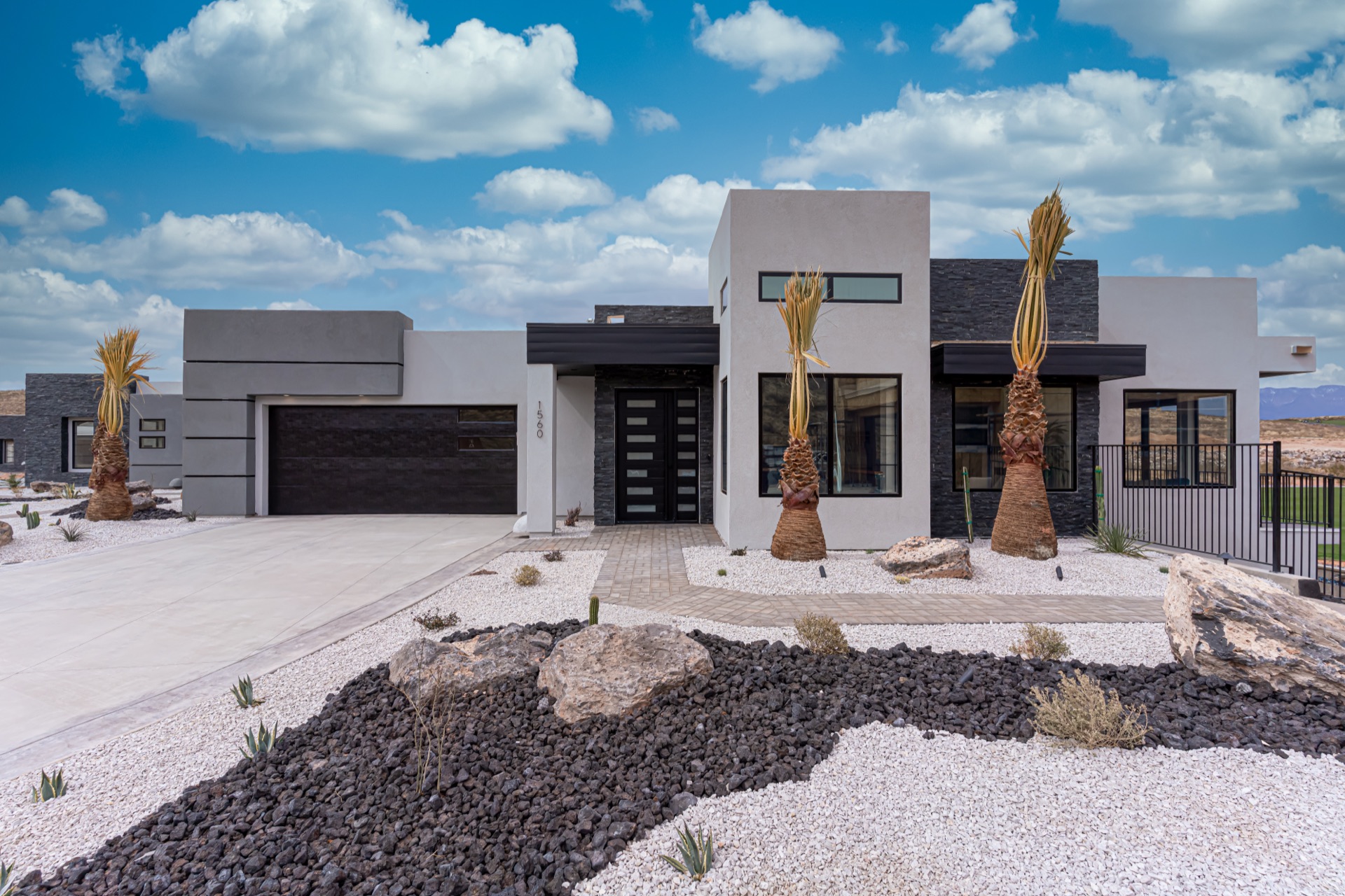 Modern Southern Utah desert home with crystal-clear windows under a blue sky