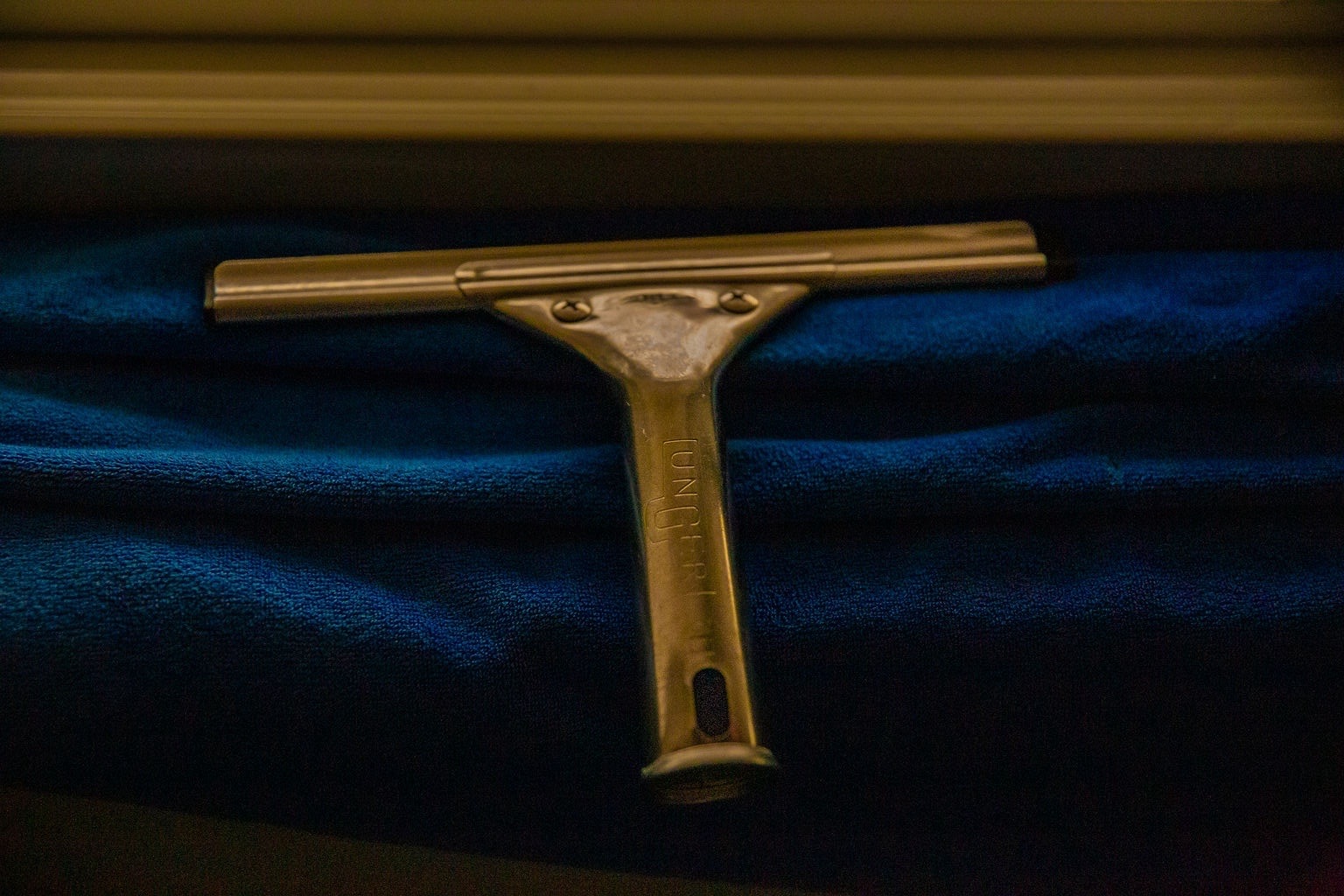Gold squeegee — Imperial Window Services detail
