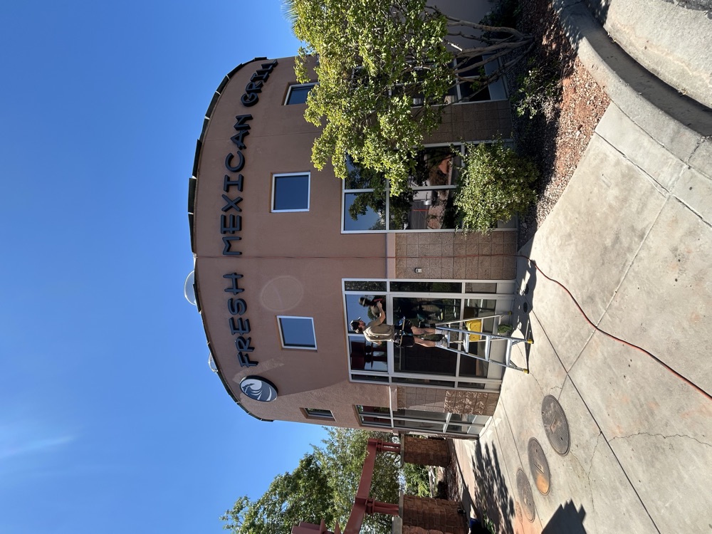 Fresh Mexican Grill storefront tint install in progress